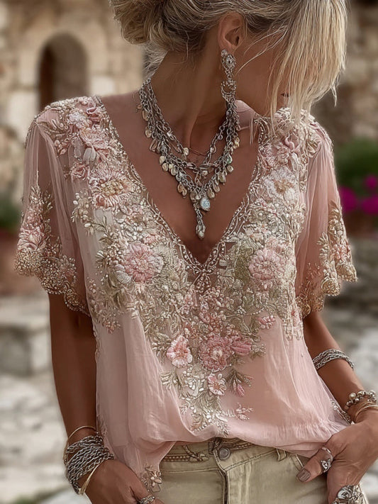 Női rövid ujjú, V-nyakú póló virágmintás hímzéssel, lenkeverék anyagból.