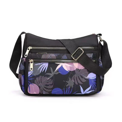 🔥Nagy kapacitású több zsebes divat nyomtatott Messenger táska