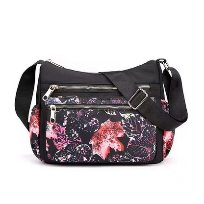 🔥Nagy kapacitású több zsebes divat nyomtatott Messenger táska